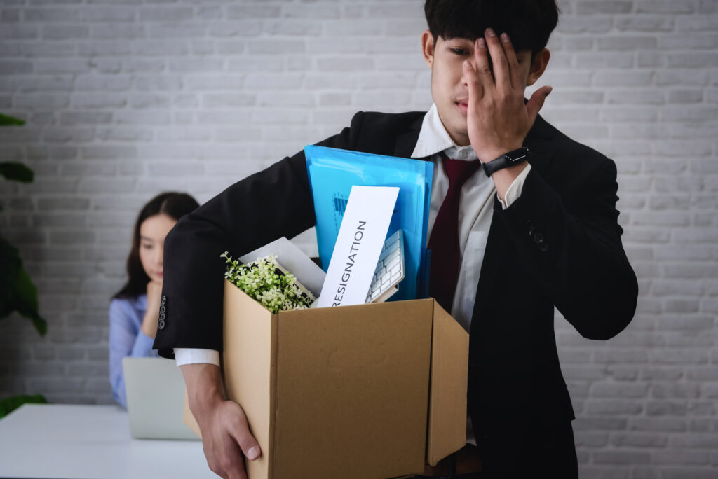 Employee leaving the office with resignation – employee retention and replacement