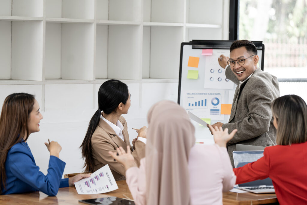 Team of employees learning together in a workshop for a skills-first workforce