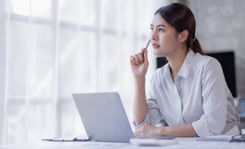Businesswoman considering different attendance systems for her company