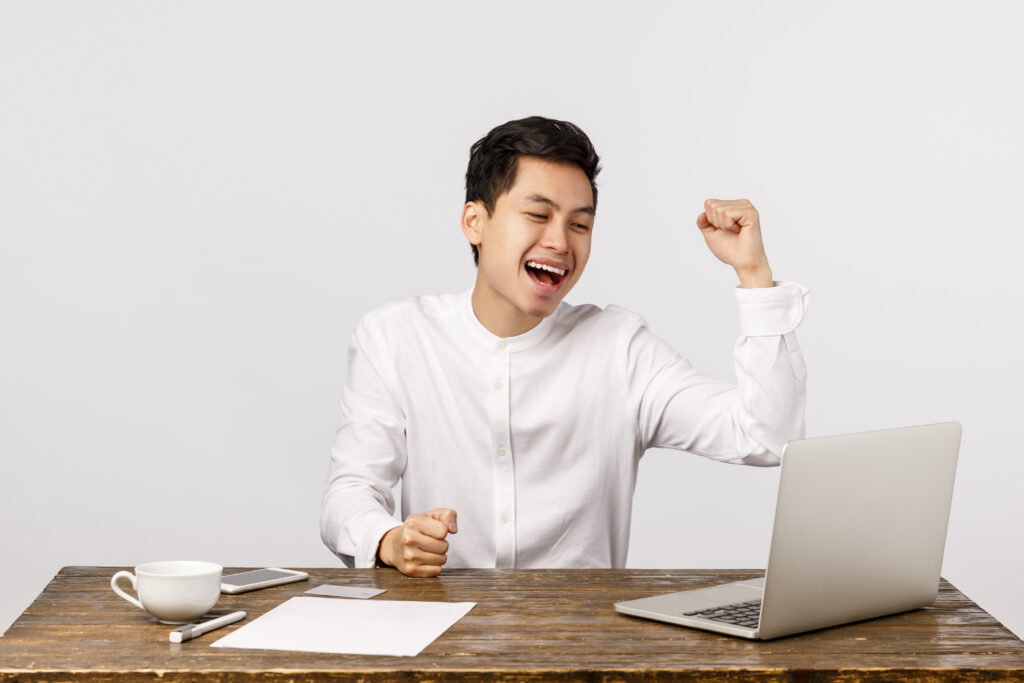 Happy employee celebrating timely salary thanks to payroll automation