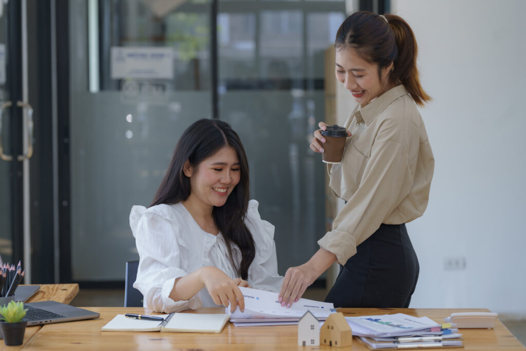 Employees sharing ideas happily, showcasing strong company culture and employer branding