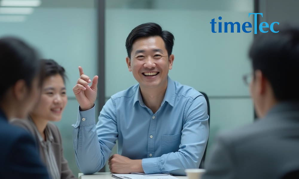 HR leader engaging with team in a meeting, fostering company culture and employer branding