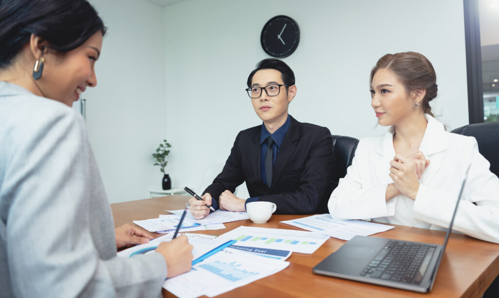 HR team discussing attendance policy with an employee in a meeting